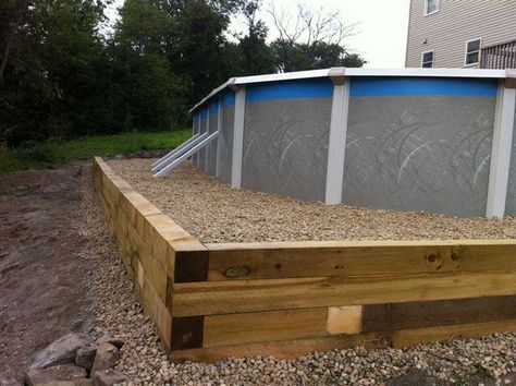 Retaining wall for above ground pool. Retaining Wall For Pool, Retaining Wall Around Above Ground Pool, Above Ground Pool Retaining Wall, Hot Tub Landscaping Ideas, Pool Retaining Wall, Diy Pools, Rectangle Above Ground Pool, Small Above Ground Pool, Pool Plans