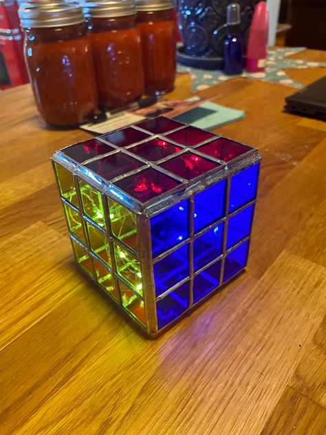 3 sides of Rubix cube. Glass. Red, yellow, blue. Stained Glass Rubix Cube, Rubix Cube Aesthetic, Rubix Cube Art, Rubric Cube, Cube Coffee Table, Twisty Puzzles, Cool Cube, Rubix Cube, Mcdonalds Toys