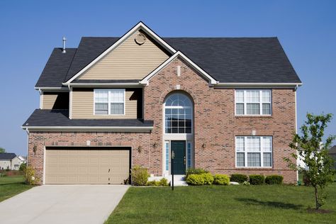 When the outside of your house has multiple materials, like siding and red brick, it gives you a fun palette for decorating your exterior for maximum ... | 1 Kilim Beige Brick And Siding Color Combinations, Siding Color Combinations, Brick House Front Door Colors, Artificial Stone Wall, Brick House Exterior, Red Brick Exteriors, Blue Siding, Siding Options, Siding Colors