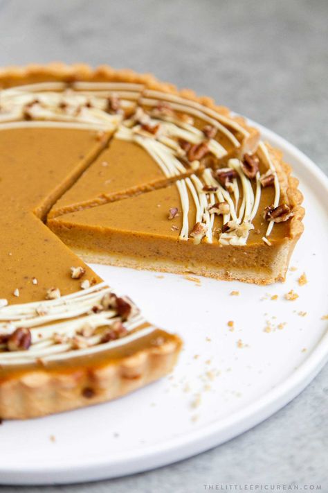 Easy Pumpkin Tart. Tart shell is made with a buttery shortbread crust. The one bowl pumpkin filling is a breeze to a make. It's decorated with melted white chocolate and chopped pecans. #pumpkin #pumpkintart #piesandtarts #dessert #thanksgiving Pumpkin Pie Shortbread Crust, Pumpkin Tarte, Thanksgiving Tart Recipes, Thanksgiving Tart, Pumpkin Tart, Fall Tart Recipes, Easy Thanksgiving Desserts, Pumpkin Tarts Recipe, Pumpkin Tarts