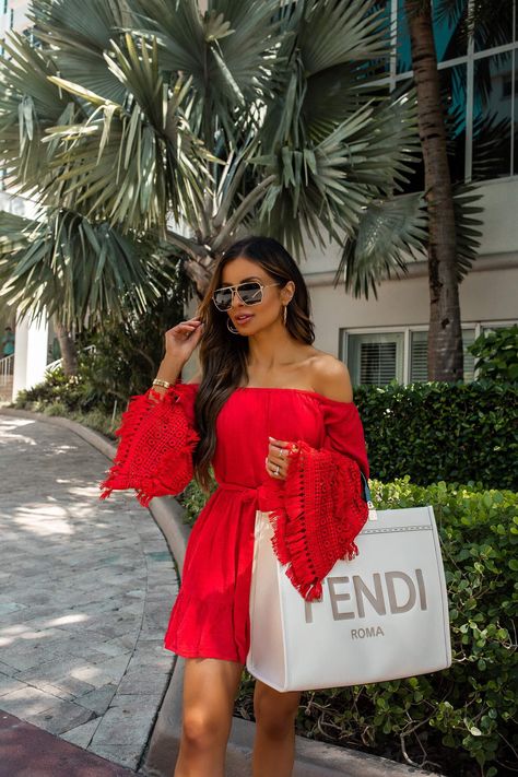 fashion blogger wearing a red off the shoulder dress and white fendi sunshine tote in miami. click here to see more resort vacation dresses, beach outfits for women, cute beach dresses, off the shoulder dresses, flirty summer dresses, and miami vacation style. #vacationoutfit #traveloutfit #beachoutfit Miami Vacation Outfits, Resort Vacation Outfits, Mia Mia Mine, Miami Vacation, Fendi Dress, Flirty Outfits, Mia Mia, Miami Outfits, Summer Vacation Outfits