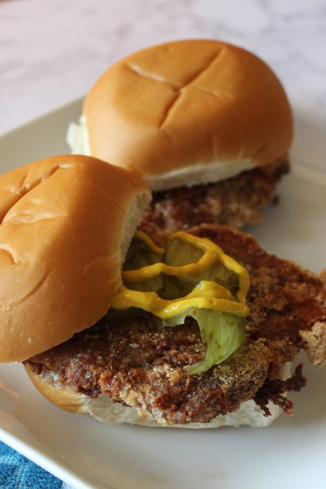 If you haven't had a pork tenderloin sandwich, then look no further for your next family meal idea. This is inspired by our family's favorite county fair meal. Featuring pork loin tenderized and flattened, breaded and deep fried to be golden brown. Served on a white roll with pickles, this sandwich is everything. Definitely a new family favorite. Breaded Pork Tenderloin, Cowboy Baked Beans, Fried Pork Tenderloin, Cheeseburger Meatloaf, Baked Sandwiches, Pork Tenderloin Sandwich, Smoked Pork Loin, Cold Sandwiches, Grilled Sandwich