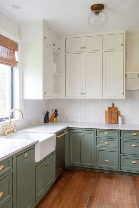 Green lower cabinets, white upper cabinets, and brass hardware. Painted Lower Kitchen Cabinets, Green Lower Cabinets White Upper, Green Lower Kitchen Cabinets, Best Kitchen Cabinet Colors, Neutral Kitchen Cabinets, Beige Kitchen Cabinets, Cabinet Color Ideas, Yellow Kitchen Cabinets, White Upper Cabinets