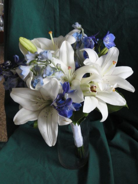 White lilies with blue delphinium Day Lily Bouquet, Blue Stargazer Lily Bouquet, Bouquet Wedding Lilies, Blue Lillie’s, Lily Prom Bouquet, Blue Lily Bouquet, Blue Stargazer Lily, Blue Delphinium Bouquet, Wedding Flowers Lilies