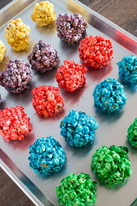 Follow these easy step by step instructions to make delicious Rainbow Popcorn Balls! They are fun to make for birthday parties, sleepovers, camping trips and dessert! Popcorn Ball Recipe, Popcorn Balls Recipe Easy, Jello Popcorn, Recipe With Corn, Marshmallow Popcorn Balls, Halloween Popcorn Balls, Flavored Popcorn Recipes, Popcorn Ball, Popcorn Balls Recipe