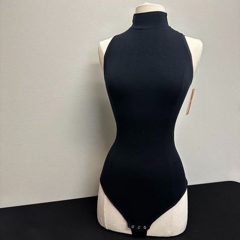 This Sleeveless Mock Neck Bodysuit Adds A Sexy Look To Jeans, Pants, And Skirts, While Comfortably Smoothing Your Tummy With Its Hugging Features. Measurements Length - 28 Inches Bust - 34 Inches *Small Hole Turtleneck Tank Top Outfit, One Piece Body Suit Outfit, Vigilante Outfit, Persona Moodboard, Sleeveless Bodysuit Outfit, Sleeveless Turtleneck Bodysuit, Body Suit Outfit, Turtleneck Leotard, Raven Costume