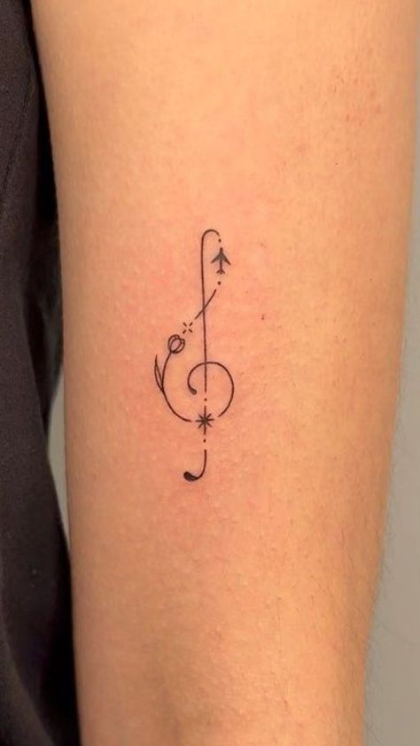 Harmony in Ink: Music notes tattoo ideas. Explore designs that capture the rhythm and melody of your favorite tunes in a timeless and artistic symphony. Music Note Tattoo Ideas, Small Music Tattoos, Notes Tattoo, Dna Tattoo, Music Notes Tattoo, Small Girly Tattoos, Henna Inspired Tattoos, Music Note Tattoo, Sharpie Tattoos