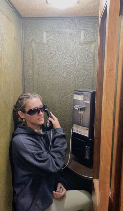 #phone #aesthetic #sunglasses #wallphone #vintage #talking #inspo Talking On Phone Aesthetic, Calling On The Phone Aesthetic, Talking On Phone, Talking On The Phone Aesthetic, Public Phone Aesthetic, Girl Looking At Phone Aesthetic, Retro Telephone Photoshoot, 90s Telephone Aesthetic, Woman On Phone Vintage