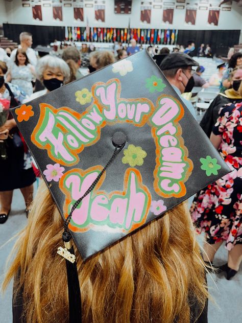 A graduation cap decorated with Mac Miller song lyrics, “follow your dreams, yeah” Grad Cap Mac Miller, Grad Cap Ideas Album Covers, Graduation Cap Mac Miller, Mac Miller Cap Decoration Graduation, Grad Cap Ideas Mac Miller, The Spins Graduation Cap, Graduation Cap Designs Mac Miller, Fleetwood Mac Graduation Cap, The Spins By Mac Miller