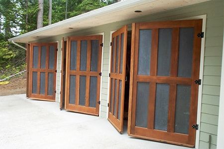 8 Garage Door Alternatives That Offer Style & Functionality | Worst Room Barn Door Garage, Small Garage Door, Shop Garage Doors, Exterior Garage Door, Barn Style Garage, Door Alternatives, Carriage House Garage Doors, Double Garage Door, Carriage House Doors