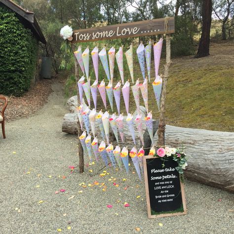 Ceremonies I Do set up this gorgeous toss some love rose petal stand. Otter Wedding, Wedding Ceremony Stage, Garden Wedding Aesthetic, Wedding Unity Ceremony Ideas, Petal Toss Wedding, Wedding Sendoff, Wedding Send Off Ideas, Wedding Unity Ceremony, Blue Reception