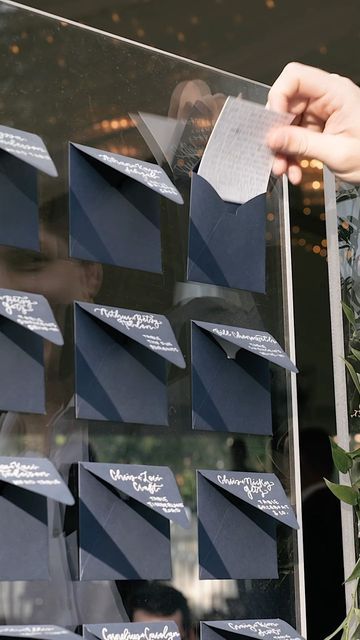 Austin Wedding Videographer on Instagram: "Is your escort wall meaningful or just a sign? Ashley and Tim included handwritten notes to each guest on a stunning ombré envelope wall titled “it takes a village.” It induced both laughter and tears and drew quite the crowd outside the tent. . . . Escort Wall and hand-lettered envelopes by the incredible @letteredbyvalerie Other vendors include @vidafilmproductions @florafetish @ashleyjett1 @missionstylehouse @timmyv17 @lootrentals @heavenlyd Handwritten Letters For Wedding Guests, Handwritten Note Seating Chart, Wedding Guest Letter Wall, Seating Wall Wedding, Handwritten Letter Seating Chart, Handwritten Notes To Wedding Guests, Envelope Wedding Seating Chart, Envelope Wall Wedding, Wedding Seating Chart Envelopes