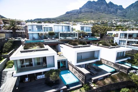 Ultimate sophisticated and luxurious lifestyle in Cape Town!  #CampsBay #CapeTown #LuxuryPortfolio Modern Industrial Home Design, Cape Town Africa, Camps Bay Beach, Camps Bay Cape Town, Africa Luxury, Modern Industrial Home, Hillside Villas, Beautiful Beach Houses, Camps Bay