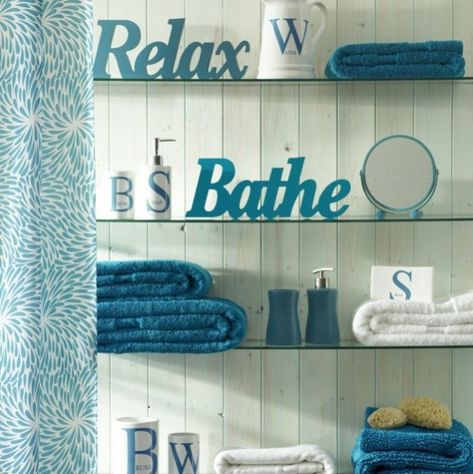 Cool teal bathroom, glass shelves and white 3-d words Small Turquoise Bathroom, Bathroom Turquoise, Turquoise Bathroom Decor, Downstairs Ideas, Teal Bathroom Ideas, Teal Bathroom Decor, Aqua Bathroom, Bathroom Downstairs, Turquoise Bathroom