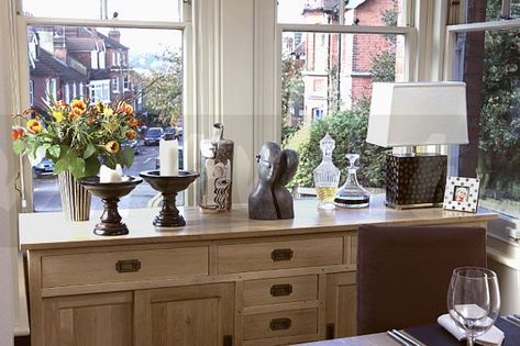 pictures of dining room sideboard in front of window - Google Search Dining Room Buffet Under Window, Buffet Cabinet In Front Of Window, Credenza Under Window, Lamps Buffet Dining Room, Dark Dining Table With White Sideboard, Dining Room Sideboard With Shelves Above, Placing Furniture In Front Of Windows, Buffet Table In Front Of Window, Buffet Under Window