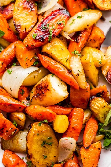 These Oven-Roasted Sweet Potatoes and Parsnips with Carrots are the homespun, seasonal side dish you need in your life! Onions, garlic, herbs, and seasoned salt add a ton of flavor to these crispy caramelized veggies. Roasted Carrots And Parsnips, Parsnip Recipes, Oven Roasted Sweet Potatoes, Roasted Root Veggies, Roasted Parsnips, Winter Veggies, Cubed Sweet Potatoes, Roasted Vegetable Recipes, Root Veggies