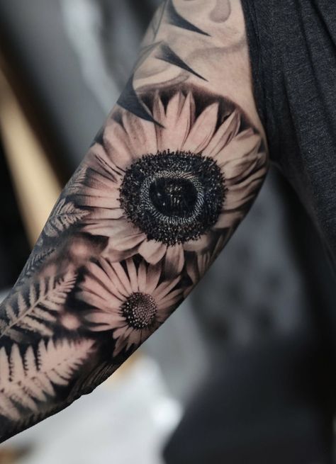 Black and gray sunflower and daisy tattoo Masculine Daisy Tattoo, Daisy Flower Tattoos Men, Men Sunflower Tattoo, Sunflower And Daisy Tattoo, Black And Grey Sunflower Tattoo, Black And Gray Sunflower Tattoo, Ferns Tattoo, Flower Tats, Sunflower And Daisy