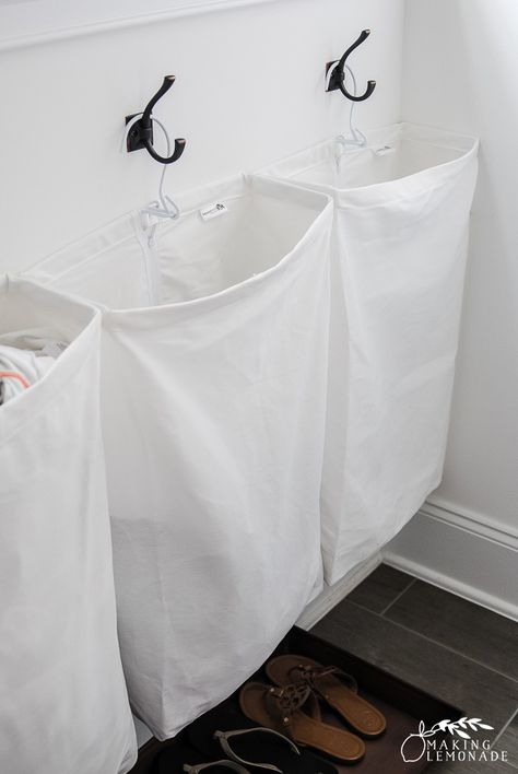 Hanging Laundry Bags On Wall, Laundry Bag Storage, Hanging Hamper Laundry Bags, Laundry Bags Hanging, Wet Wash Cloth Hanging Ideas, Wall Hanging Laundry Baskets, Hanging Laundry Baskets On Wall, Laundry Bag Ideas, Hanging Laundry Baskets