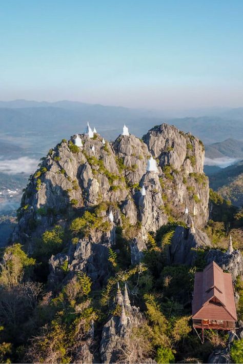 A breathtaking place with a meaningful story behind its existence, Wat Chaloem is a temple made of floating pagodas on top of a mountain, located in Lampang, Northern Thailand. Read my blog post on how to get there and avoid crowds | Be My Travel Muse | Northern Thailand travel tips | thailand road trips | Thailand off the beaten path Thailand Activities, Thailand Packing, Koh Samui Beach, On Top Of A Mountain, Thailand Itinerary, Thailand Adventure, Thailand Backpacking, Top Of A Mountain, Thailand Travel Tips