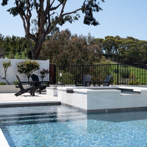 modern pool design in Laguna Niguel California Black Waterline Tile Pool, White Waterline Tile Pool, Pool With Black Tile, Modern Pool Tile Ideas Waterline, Black Pool Tiles, Black And White Pool Tile, Pool Tile Waterline Modern, Grey Pool Tile, Grey Pool Liner