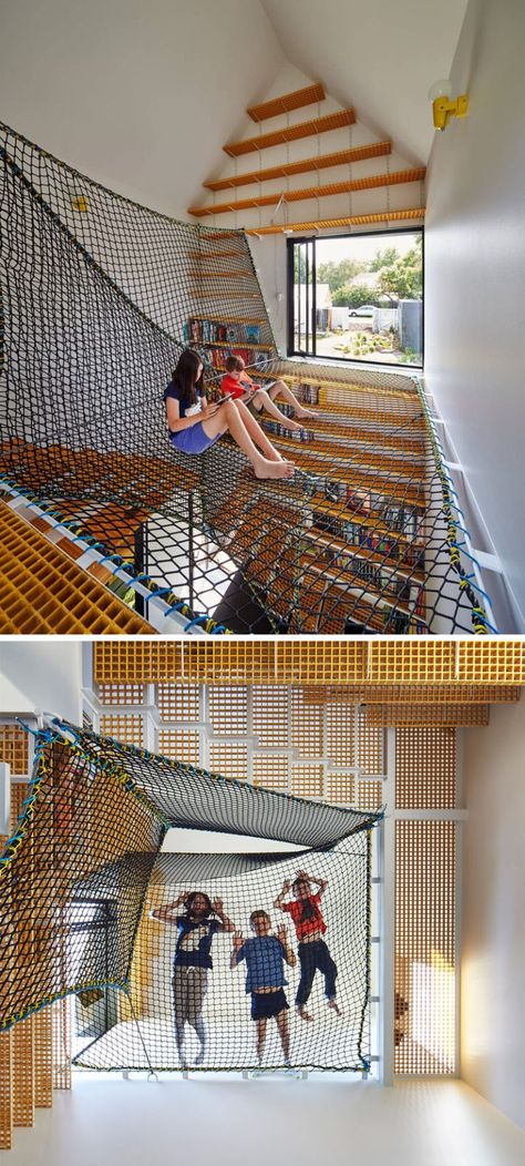 This book room features a large system of suspended nets that create the perfect spot to curl up with a book, a game, or spy on the people down below. Indoor Hammock Bed, Hang Out, Indoor Hammock, Houses In France, Hammock Bed, Book Room, Tower House, Home Libraries, Play Space