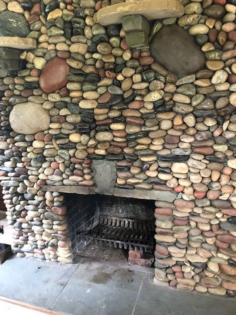 We recently purchased property in Virginia with a small farmhouse cottage (832 sq. ft.) as a vacation home for us. The home was built in the 1940's, while in good repair - needed lots of cosmetic updates. The tiny living room contained this very large brick fireplace that someone had mortared round river rocks on it. While the rocks are pretty, but we wanted to bring the fireplace back to brick - to update the room and gain space. We also soon found out that the rocks were unsafe, many of them Fireplace Renovation, Diy River Rock, Make A Fire Pit, River Rock Fireplaces, Rock Fireplace, Painted Brick Fireplace, Painted River Rocks, Fireplace Update, Brick Fireplace Makeover