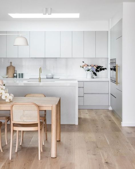 A design classic 🤩⁠ Keeping it neutral in the kitchen with versatile grey doesn't have to be boring! Grey works with many styles and contrasts beautifully with other shades, such as the warm wooden flooring and furniture seen in this kitchen designed by @coco.camellia_. It also works wonderfully with metals, like the brushed gold of our Vivid Slimline Gooseneck Sink Mixer. ⁠ Pale Grey Kitchen, Kitchen Design Inspiration, Award Winning Kitchen, Rustic Kitchen Island, White Kitchen Design, Grey Kitchen Cabinets, Grey Kitchens, Kitchen Room Design, Grey Kitchen