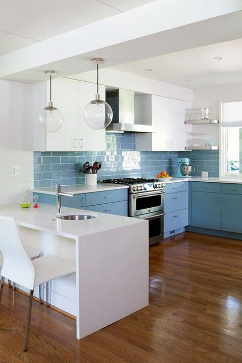 Opt for table-height. In this imaginative Christie Leu kitchen, an L-shaped island cum room divider with a dining-height profile makes the space feel even larger. And is that a second sink we see? With a setup this ideal, we might have to take up ikebana.  10 Bonkers-Gorgeous Kitchen Island Ideas You Haven’t Seen Before   #purewow #home #kitchen #renovation #kitchenisland #kitchens #kitchenideas #homedecor #decorideas Bathroom Ideas Color, Unique Kitchen Island, Kitchen Makeover Projects, Diy Kitchen Makeover Ideas, Creative Kitchen Ideas, Diy Kitchen Makeover, Remodeling Trends, Double Kitchen, Kitchen Makeover Ideas