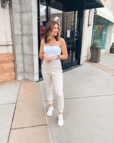 Cream joggers with a white bodysuit and white tennis shoes. Joggers Outfit Women Summer, Comfortable White Spring Joggers, Cream Joggers Outfit, Cream Joggers Outfit Women, White Cotton Everyday Joggers, Beige Relaxed Fit Casual Joggers, Spring Beige Relaxed Fit Joggers, Trendy Relaxed-fit Joggers With Drawstring, Cream Joggers