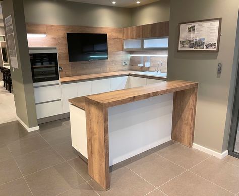 Breakfast Bar Added To Counter, White Kitchen Breakfast Bar, Kitchen Ideas With Bar Layout, Kitchen Half Island Ideas, Adding Breakfast Bar To Counter, Split Level Breakfast Bar, Breakfast Bar Extension Counter Tops, Breakfast Island Kitchen, Kitchen Ideas With Breakfast Bar