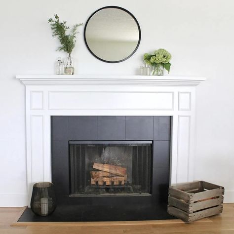 Wondering if you can paint fireplace tile surround? Check out this guide for all the tips and tricks for refacing tile for a fireplace makeover! And see what this black and white beauty looked like before! Tiled Fireplace Surround, How To Paint Fireplace, Tile Fireplace Makeover, Paint Fireplace Tile, White Fireplace Surround, Painted Fireplace Mantels, White Mantle, Tile Fireplace, Fireplace Tile Surround