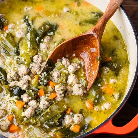 Italian Wedding Soup combines tiny meatballs made with beef and pork, acini di pepe pasta, fresh veggies, and greens simmered together in a tasty and nourishing broth. This may be a soup, but it's robust enough to be a complete meal! Wedding Soup Meatball Recipe, Tiny Meatballs, Traditional Italian Wedding, Italian Beef Stew, Sip And Feast, Italian Wedding Soup Recipe, Hearty Vegetable Soup, Italian Comfort Food, Homemade Chicken Stock