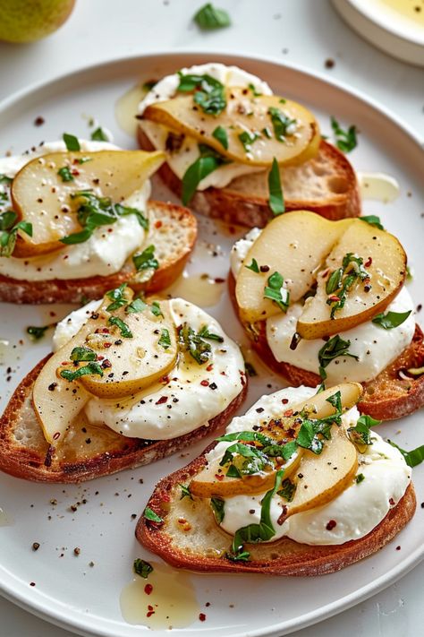 Indulge in the refined simplicity of our Gluten-Free Pear and Burrata Crostini, a delightful blend of fresh, organic ingredients and artisanal quality. This recipe, perfect for the Whole Health Flexi-Plan diet, offers a gourmet experience with healthful benefits. Each bite delivers a fusion of sweet, juicy pear and creamy, luxurious burrata on top of crisp, golden-brown gluten-free crostini. Burrata Crostini, Gluten Free Baguette, Gourmet Gluten Free, Burrata Recipe, Gluten Free Vegetarian Recipes, Burrata Cheese, Healthy Appetizers, Fresh Thyme, Raw Honey