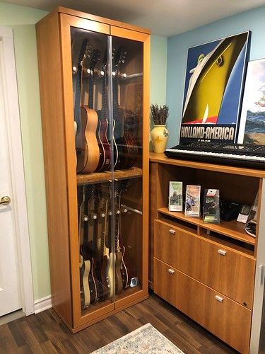 Armoire1 | Oldschool59 | Flickr Storage For Musical Instruments, Storing Guitars At Home, Studio Guitar Room, Ikea Guitar Display, Instrument Case Storage, Music Collection Display, Guitar Practice Room, Instrument Storage Ideas Music Rooms, How To Store Guitars