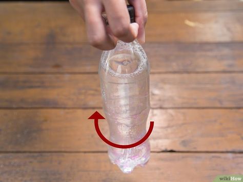 How to Make a Tornado in a Bottle: 12 Steps (with Pictures) Tornado Gif, Tornado In A Bottle, Small Water Bottle, Evian Bottle, 12 Step, 12 Steps, Tornado, Plastic Water Bottle, Spinning