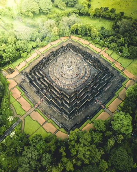 Borobudur is one of the great monuments of Southeast Asia. It is a colossal Buddhist stupa that rises out of the rice paddies and palm trees with the nearby volcano Gunung Merapi in the distance. Buddhist Architecture, Buddhist Stupa, Borobudur Temple, Drone Images, Central Java, Buddhist Temple, Birds Eye, Pilgrimage, Aerial View