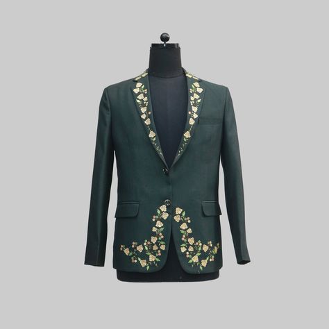 This green blazer is embroidered with white and yellow flowers on the sleeves. The flowers are in a variety of shapes and sizes, and they are arranged in a delicate pattern. The blazer has a classic cut with a single-breasted closure and two flap pockets at the waist. 
Features:

Modern, tailored fit
Embroidered with intricate African designs
Made of high-quality materials
Perfect for any occasion, from a casual party to a formal wedding

#fashion #christmas #weddingdresses #christmaswishlist Unique Mens Wedding Suits, Tuxedo Wedding Suit, Blazer Wedding, Gold Blazer, Suit Tuxedo, Mens Western, Embroidered Suit, Tuxedo Wedding, Green Blazer