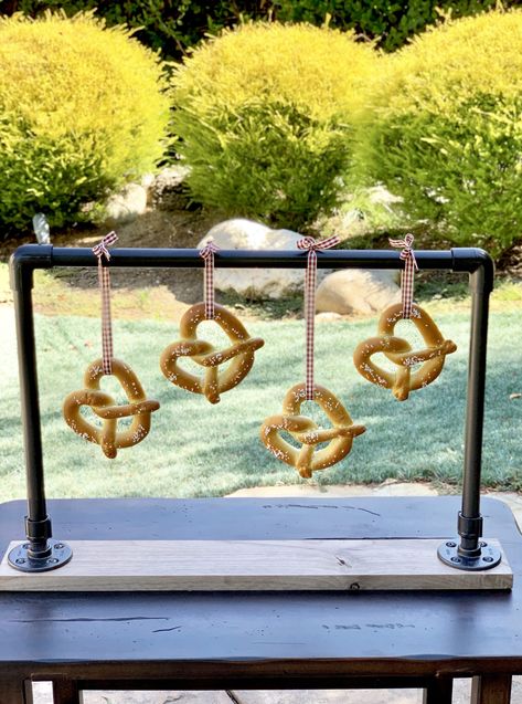 I have an easy tutorial for you on how to make a hanging pretzel bar! This will also work for donuts and bagels and party favors as well! With a few supplies from a hardware store, some easy drilling and spray paint, you’ll have a great presentation and centerpiece for your next gathering! I love […] Pretzel Stand, Pretzel Bar, Pretzel Bars, Long Pipe, Fall Entertaining, Great Presentations, Fall Party, Event Inspiration, Diy Party Decorations