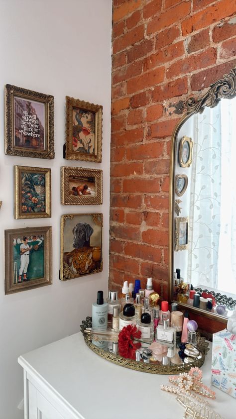 Vintage inspired ornate gallery wall + mirror on brick Gallery Wall Mirror, Vintage Wall Collage, Apartment Vision Board, Photo Mirror, Mirror Gallery Wall, Pictures Frames, Brooklyn Apartment, Mirror Vintage, Mirror Photo