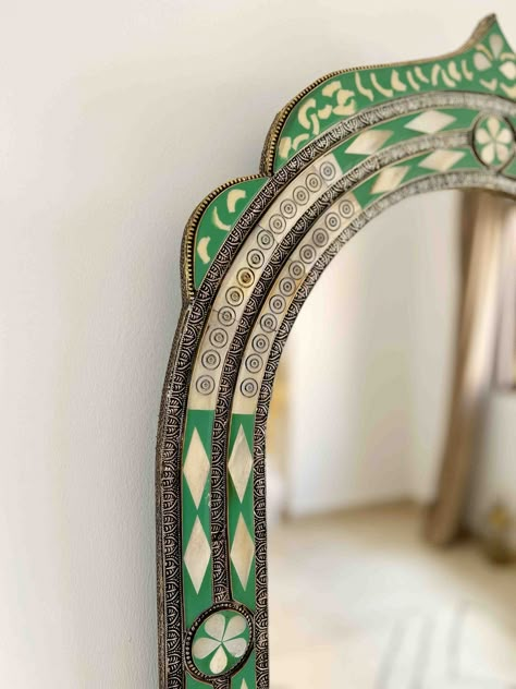 Vintage Moroccan Mirror | Arch Bone inlay Wall Mirror, Green Frame Mirror, Bathroom Mirror, living room Mirror, Bedroom Mirror , Home DecorStep into a world of exotic elegance with our luxury Moroccan wall mirror. Carefully crafted by our team of skilled artisans, this breathtaking piece is a stunning fusion of bone and brass, showcasing intricate Berber and Moroccan engravings that evoke the rich cultural heritage of North Africa.The solid bone frame is adorned with intricate Berber engravings Statement Bathroom Mirror, Standing Mirror In Living Room, Marocco Interior Design, Arch Mural, Tile Mirror Frame, Heritage Decor, Mirror Arch, Arch Wall Mirror, Mosaic Mirror Frame