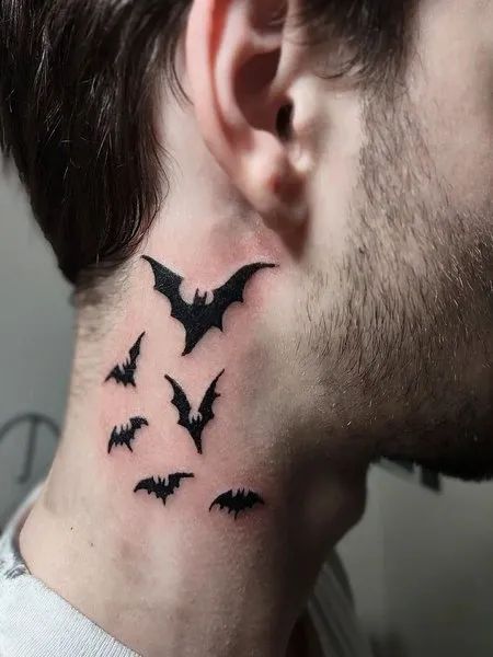 Halloween Neck Tattoo Halloween Neck Tattoo, Bats Neck Tattoo, Side Neck Tattoo Ideas, Bats On Neck Tattoo, Bats Tattoo Ideas, Bat Wing Neck Tattoo, Neck Bat Tattoo, Upper Back Tattoos For Guys, Spooky Neck Tattoo