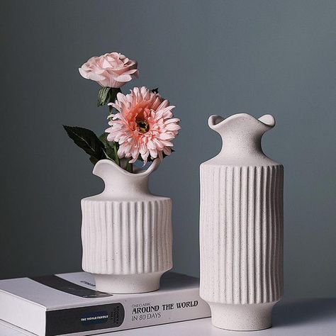 PRICES MAY VARY. High-quality ceramic vase with a lightly speckled, textured finish Elegant in both the tall and small version & especially as a duet Ideal vases for centerpieces in any season Decorative modern look with a natural edge - beautiful on its own or with fresh or dried florals Satisfaction guaranteed The Imperial Fluted Vase showcases a regal aesthetic that resonates with your own royal energy. Its graceful lines and refined stature were carefully crafted to complement and enhance yo Modern Flower Vase, Short Vase, Fluted Vase, Pottery Houses, Creative Flower Arrangements, Tall Vase, Clay Vase, White Vase, Ceramic Flower Pots