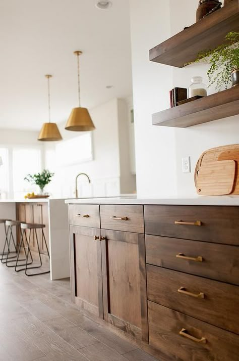 Gorgeous brown oak shaker cabinets are accented with brass pulls and a white quartz countertop fixed beneath stacked brown oak floating shelves. Contemporary Wooden Kitchen, Wooden Kitchen Cabinets, Brown Kitchen Cabinets, Shaker Style Cabinets, Brown Cabinets, Brown Kitchens, Kitchen Cabinet Colors, Modern Farmhouse Kitchens, Kitchen Redo