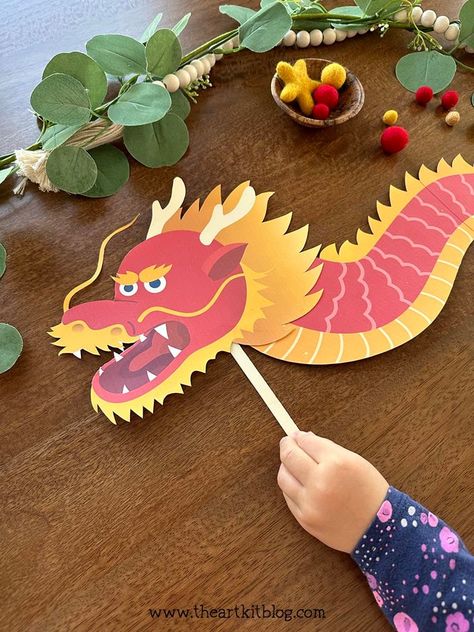 Chinese New Year Dragon Paper Craft {FREE PRINTABLE!} Chinese New Year Dragon Bulletin Board, Chinese Dragon Paper Craft, Chinese New Year Art And Craft Preschool, Diy Dragon Crafts, Chinese New Year Dragon Art, Dragon Diy Craft, Chinese New Year Dragon Decorations, Year Of The Dragon Art, Chinese New Year Dragon Craft