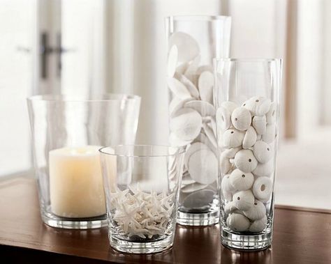 Glass cylinder vases are one of the most versatile accessories in decorating. With their simple and classic shape, as well as accessibility at a variety of price points, it’s no wonder they’ve become a favorite amongst decorators and a staple in decor. If I think about how many glass cylinders I have in my own ... Read More about 10 Ways to Decorate With Glass Cylinders Glass Cylinder Ideas, Glass Vase Filler Ideas, Jar Filler Ideas, Vase Filler Ideas, Jar Fillers, Tall Glass Vase, Deco Marine, Large Glass Vase, Glass Vase Decor