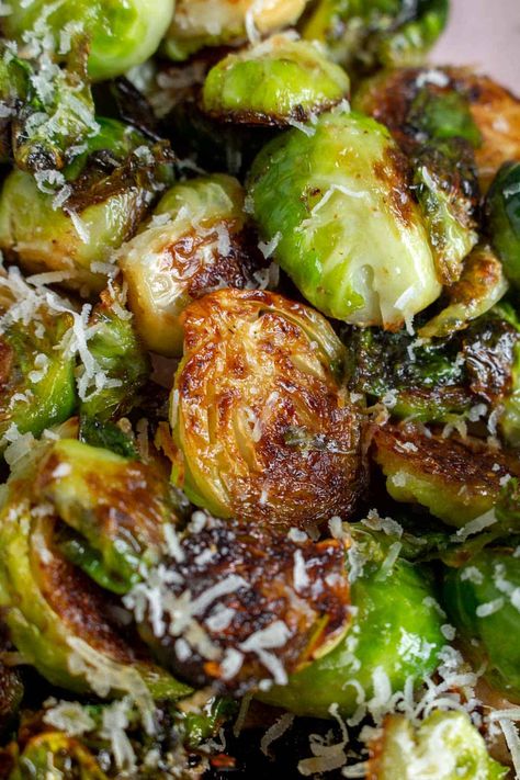 Quickly made on the stovetop, these Pan Fried Brussels Sprouts are a quick and easy side dish that is perfect for any occasion. Topped with freshly shaved parmesan, you won't be able to get enough of this sauteed brussels sprouts recipe.