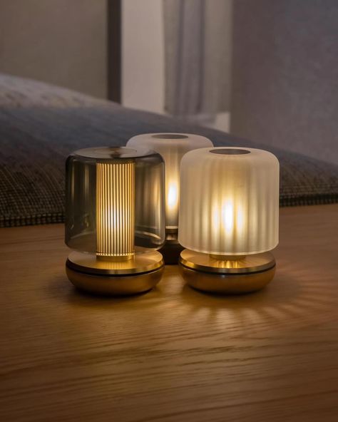 Such an amazing glow from an exquisite tealight, up to 220 hours of light from a single charge so no messy cables, it has 3 dimmable settings and comes in the most attractive colours of bronze and gold bases with a choice of frosted or smoked shades #elegantlights #lighting #lightdesigns #homedecor #interiors #pendants #lightingsolutions #essexlighting #chelmsfordlighting #lightingideas #exquisitelighting #lightinginspiration #luxurylighting #chandelier #ledlights #ceilinglighting #glassligh... Cordless Table Lamps, Design Lamp, Cordless Lamps, Flickering Lights, Gold Table Lamp, Tea Candles, Outdoor Table Lamps, Portable Table, Portable Lamps