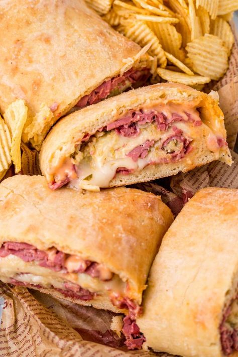 Are you looking for a new and exciting twist on the classic Reuben sandwich? Look no further than the delectable Reuben Garbage Bread! Rueben Appetizer Recipes, Rueben Stromboli, Reuben Stromboli, Classic Reuben Sandwich, Garbage Bread, Reuben Recipe, Reuben Sandwich Classic, Reuben Sandwiches, Stuffed Breads