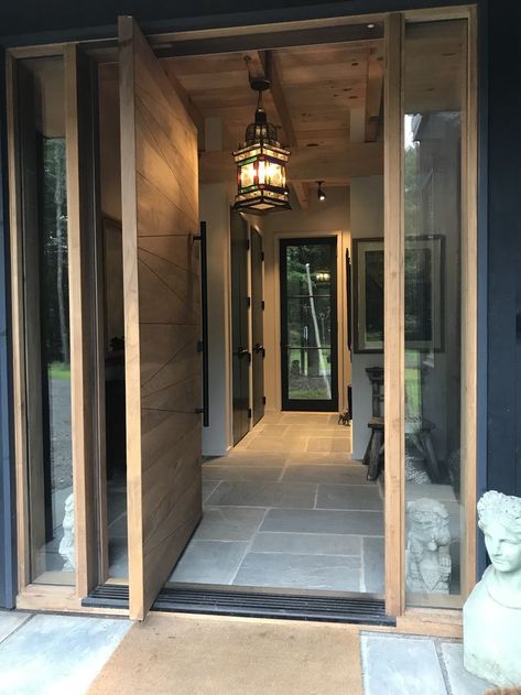 Pivot Door Design, Steel Doors Exterior, Welcoming Entryway, Modern Entry Door, Pivot Door, Diagonal Lines, Window Unit, Door Company, Pivot Doors