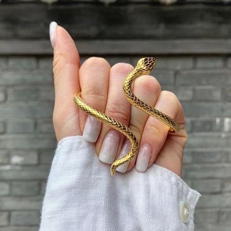 Here’s a sneak peek of our new snake bangle in gold, stay tuned!  https://noirdes.co/collections/bangle/products/infinity-snake-bangle Greek Outfit, Infinity Snake, Snake Jewellery, Gold Cuff Bangle, 2020 Aesthetic, Snake Bangle, Snake Lovers, Bangle Gold, Bold Accessories